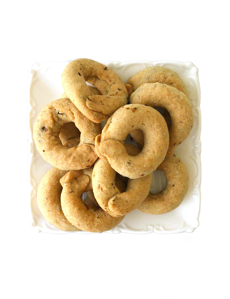 Traditional Savory Salted Kaak biscuits with nigella seeds on a white plate.