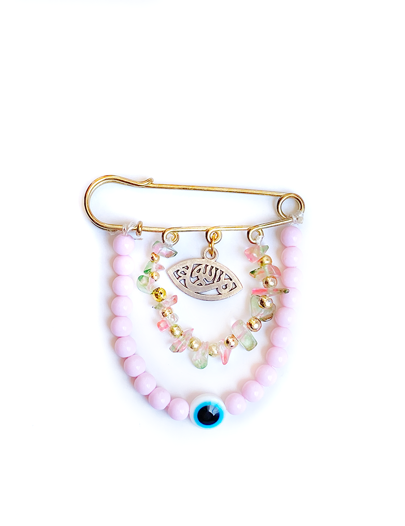 Gold baby pin with pink beads, blue eye charm, and Arabic calligraphy pendant.