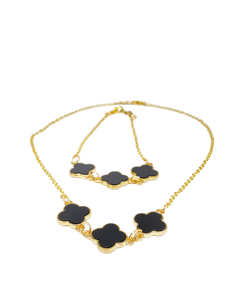 Front view of black clover necklace and matching bracelet set on white background.