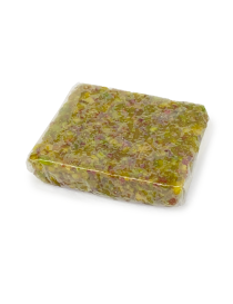 Close-up of a single square of textured pistachio harissa candy.
