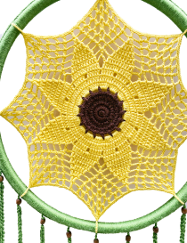 Detailed view of the intricate yellow crochet sunflower pattern and brown center.