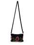 Front view of a black tapestry crochet crossbody bag with a large pink and green floral design.