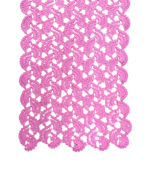 Close-up of pink crochet openwork lace texture.