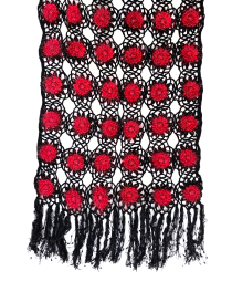 Flat lay of the rectangular 150x50cm crochet scarf showing the floral grid pattern.