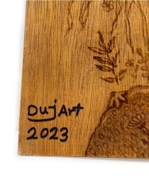 Artist signature "DujArt 2023" burned into wood.