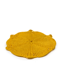 Close-up of yellow cotton thread crochet coaster stitching.