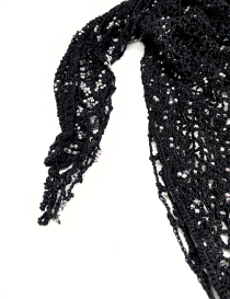 Detailed view of crochet edging and silver beadwork on black yarn.