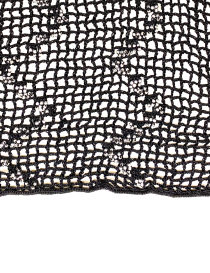 High-resolution texture of black crochet mesh grid with silver beads.