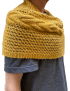 Golden pashmina wrap styled as a shoulder warmer.