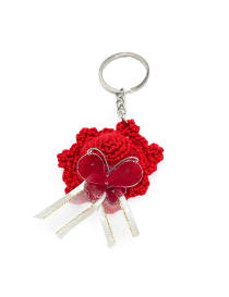 Red crochet sun hat keychain with butterfly bow detail.