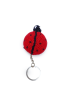 Overhead view of a round red and black amigurumi ladybug keychain.