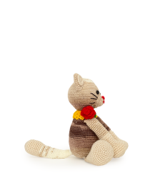 Full side view of the handmade amigurumi cat against a white background.