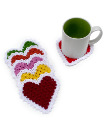 Top-down view of stacked heart coasters and a coffee mug on a white background.