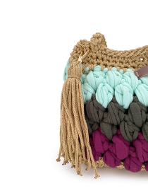 Close-up of the decorative champagne yarn tassel with gold-tone hardware.