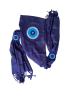 Full view of folded navy blue shawl showing three crocheted eye motifs and tassels.