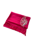 Folded fuchsia linen shawl showing the texture of the fabric and the placement of the beaded motif.