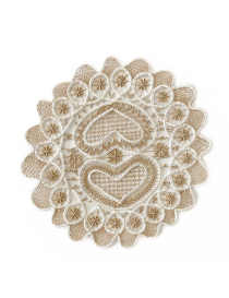 Overhead view of 28cm handmade lace doily with heart motif.