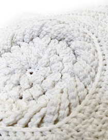 Detailed view of handmade crochet loops and textured yarn patterns.