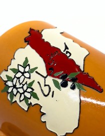 Orange handcrafted ceramic mug featuring a 3D map of Syria and white jasmine flowers.
