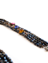 Close-up of the matching three-strand black bead bracelet.