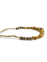 Side view showing gold-tone faceted and pyrite-style beads.