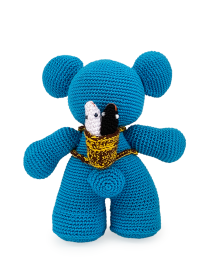 Back view of blue bear showing a woven basket containing two tiny crochet fish.