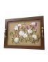 Front view of a wooden tray with white and purple ribbon-embroidered flowers on burlap.