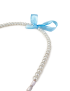 Close-up of sky blue ribbon bow on a white pearl beaded headband.